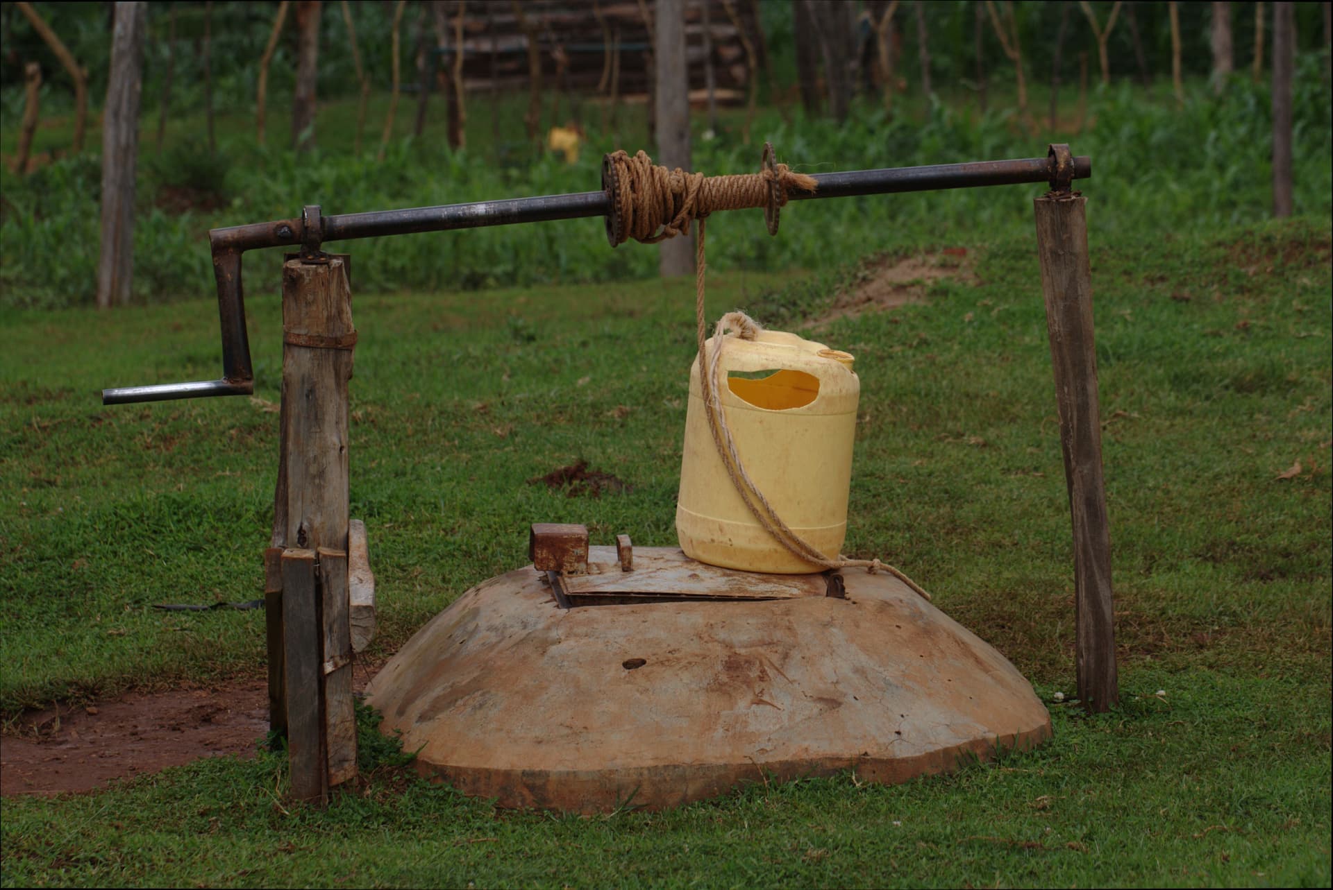 Well head and pump housing on rural land