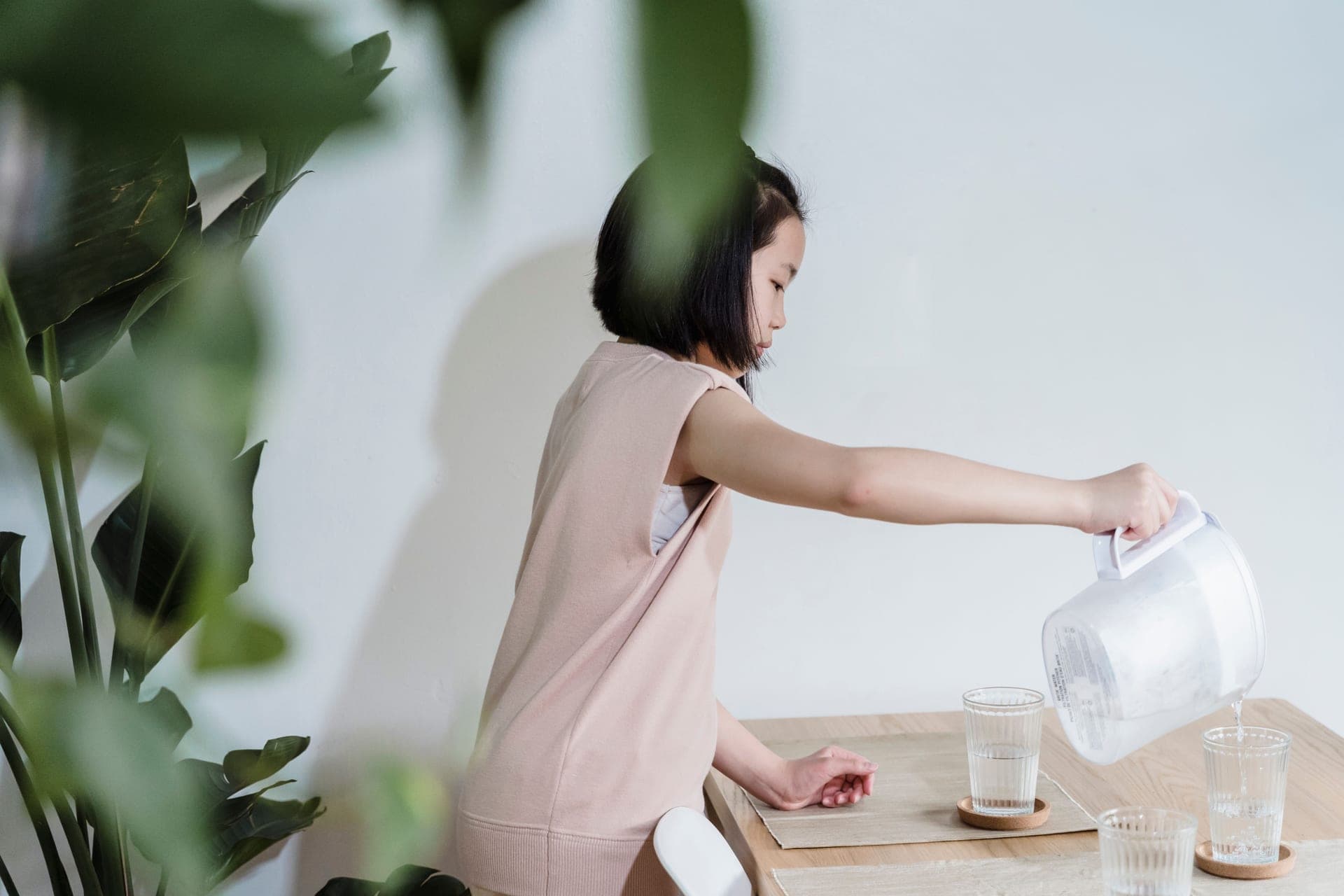 Water being poured from a filter pitcher