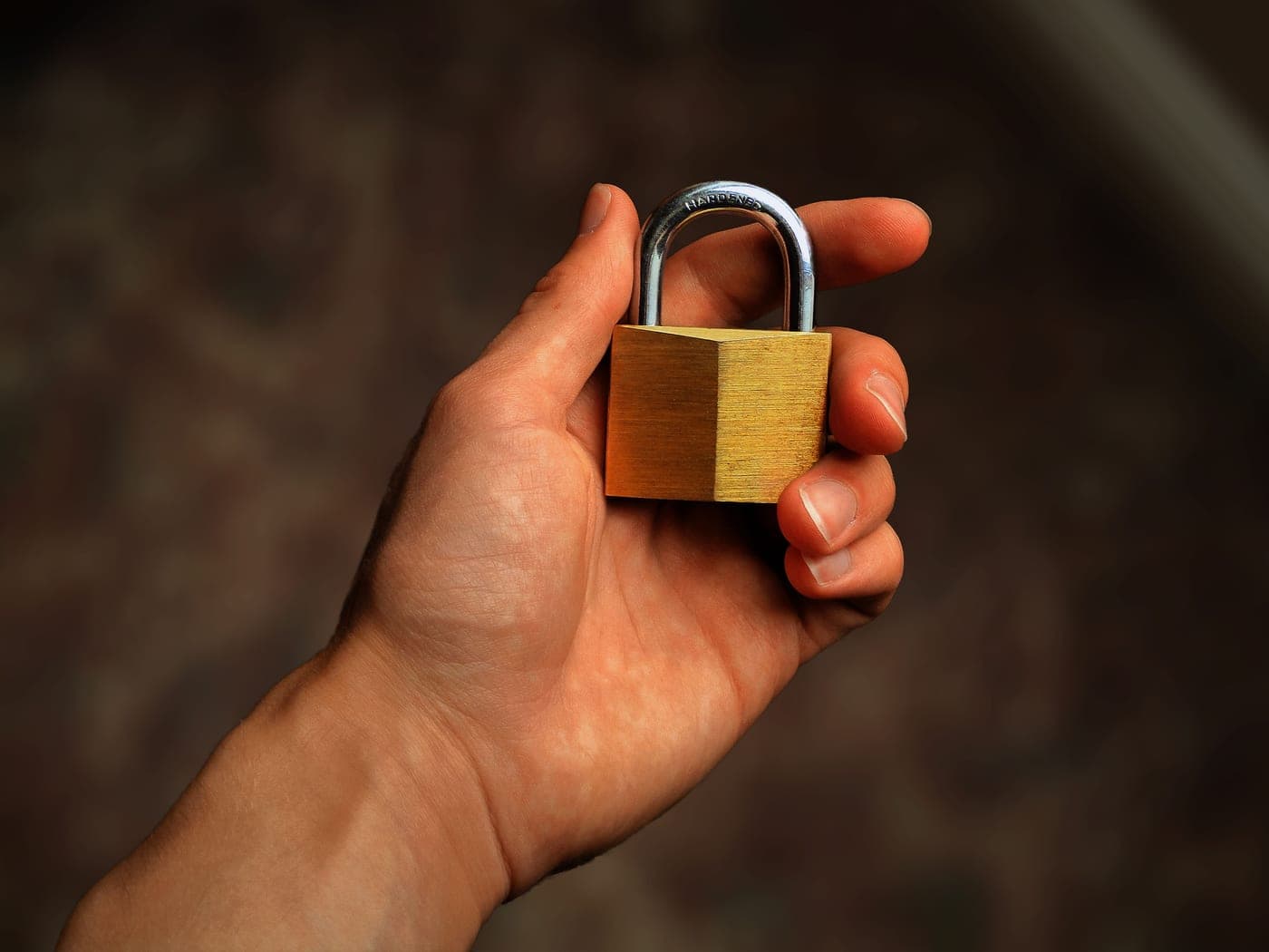 A padlock resting on a laptop keyboard