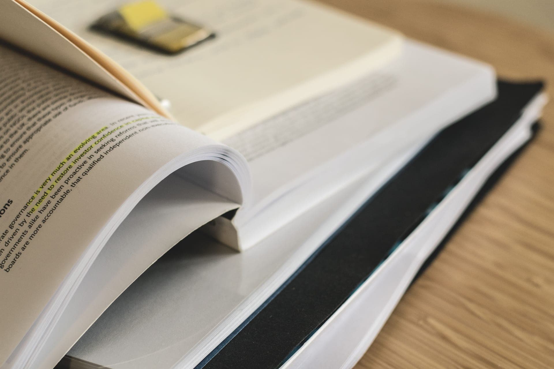 Reading a printed report at a kitchen table