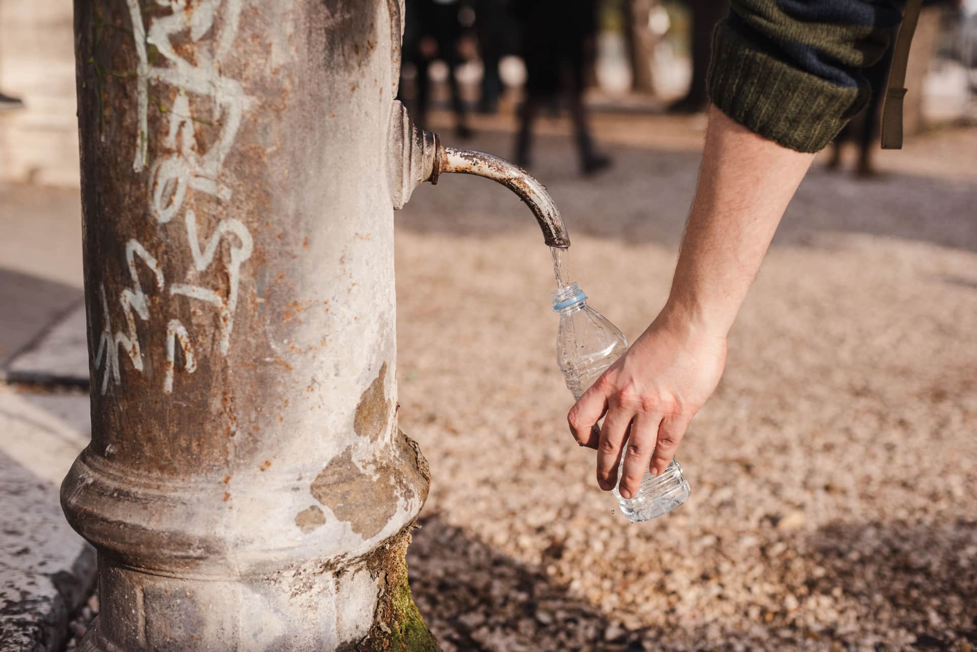 Collecting a water sample from an outdoor tap
